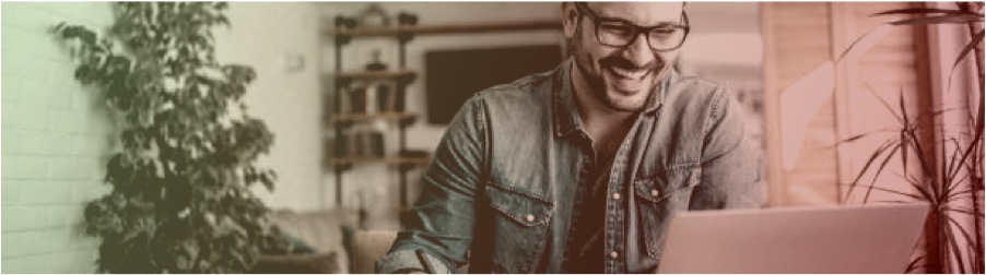 Happy employee working on a laptop