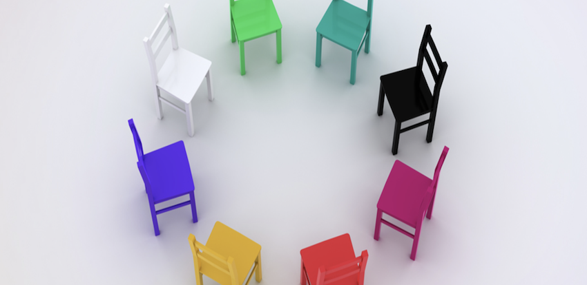 Colorful chairs arranged in a circle